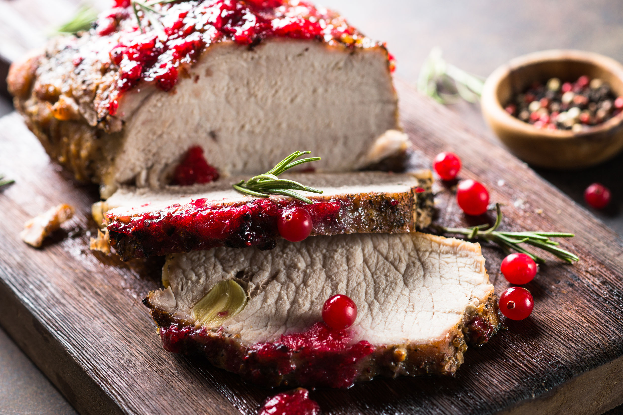 Pork ham baked with cranberry sauce. Close up.