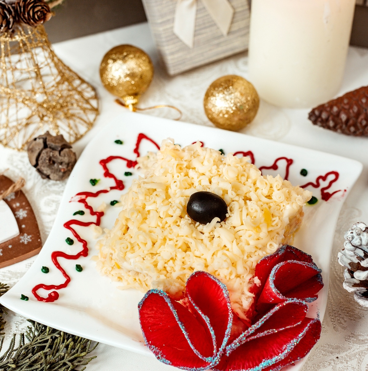 mimosa salad topped with olive